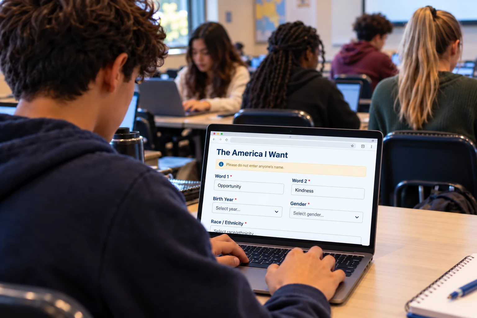 Student completing The America I Want survey with two word fields and background questions on a laptop in a classroom